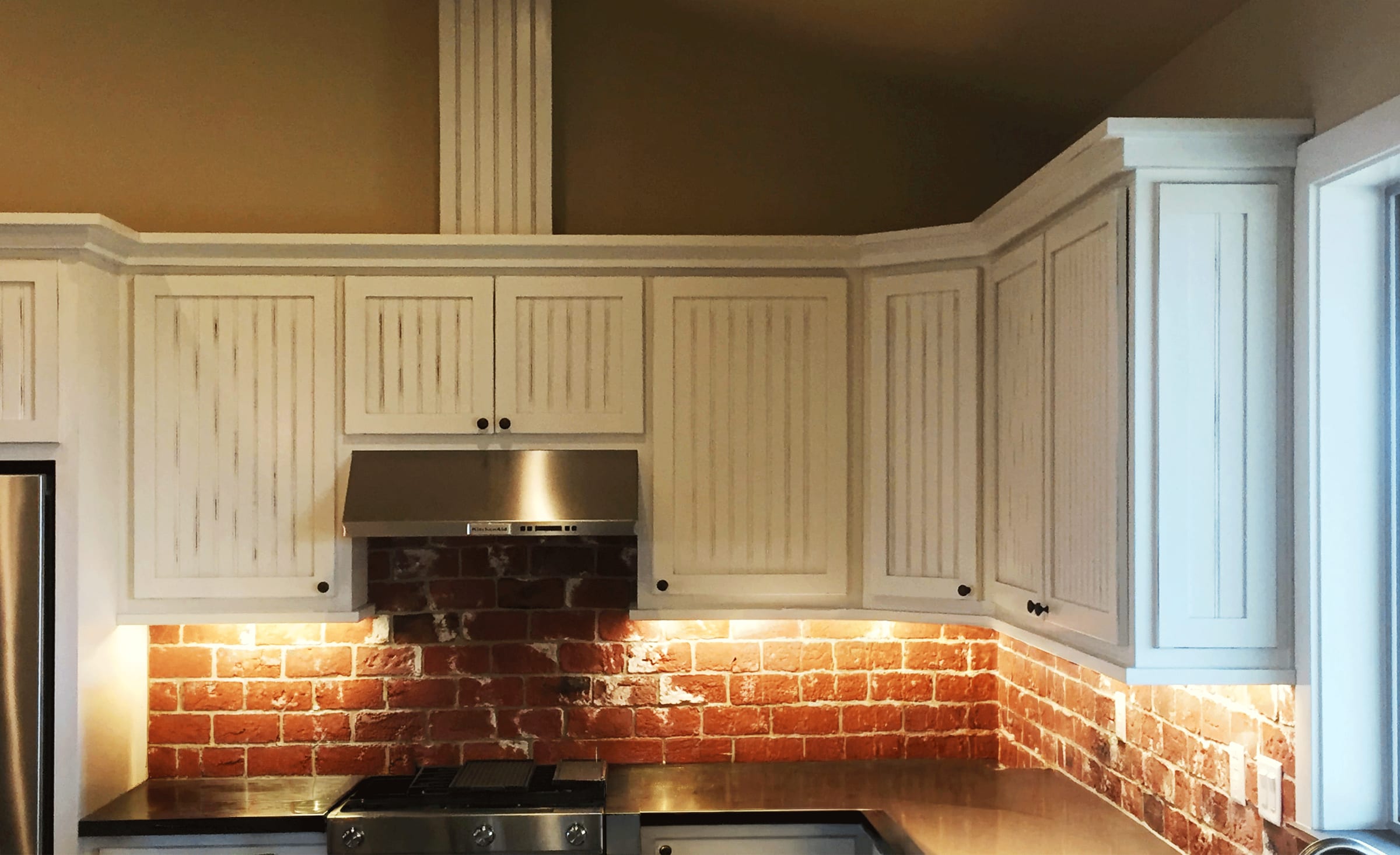 Cottage Kitchen with Brick Backsplash